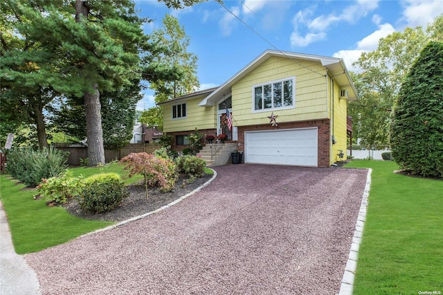 1 Smith St, Glen Head, NY 11545 - split foyer home featuring brick siding, an attached garage, gravel driveway, and stairway