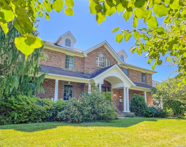 view of front of home with a front yard