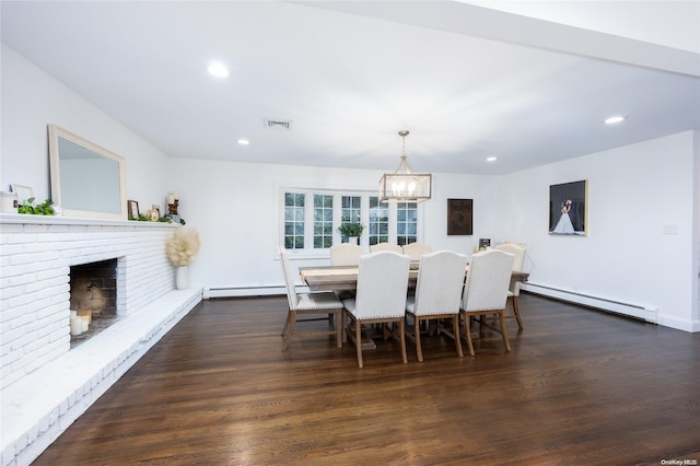 dining space with dark hardwood / wood-style floors, a fireplace, and a baseboard radiator