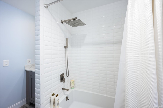 bathroom featuring vanity and shower / tub combo