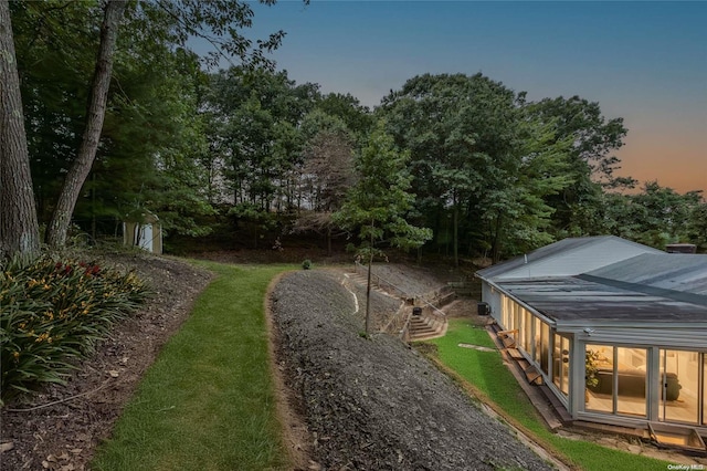 yard at dusk with an outdoor structure