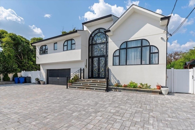 view of front of property with a garage