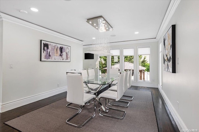 dining space with a chandelier, crown molding, and dark wood-type flooring