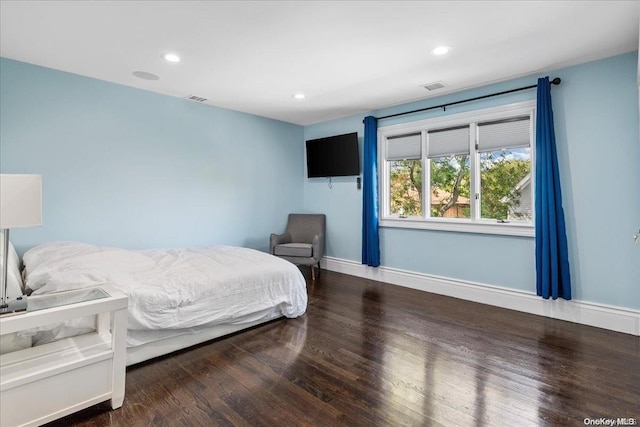 bedroom featuring hardwood / wood-style flooring