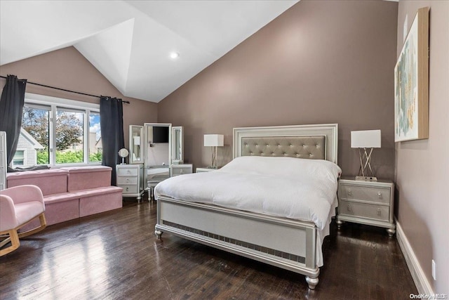 bedroom with high vaulted ceiling and dark wood-type flooring