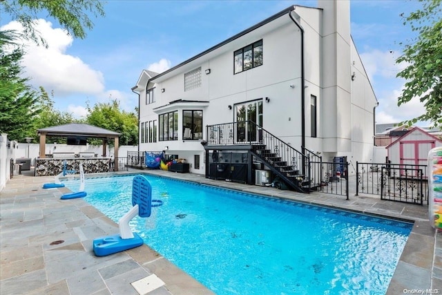 view of pool featuring a gazebo and a patio