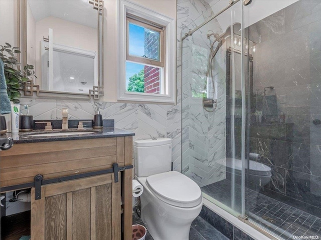 bathroom featuring decorative backsplash, vanity, a shower with door, tile walls, and toilet