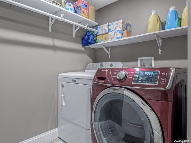 washroom with independent washer and dryer