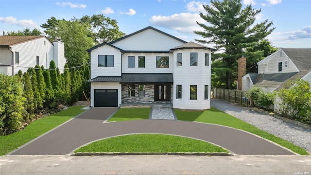 view of front facade with a front lawn and a garage