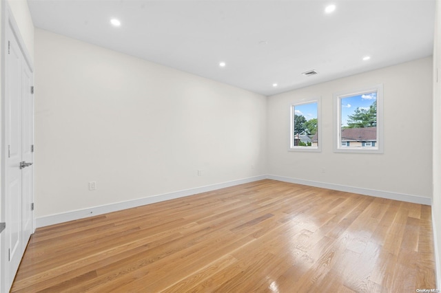 spare room featuring light hardwood / wood-style floors