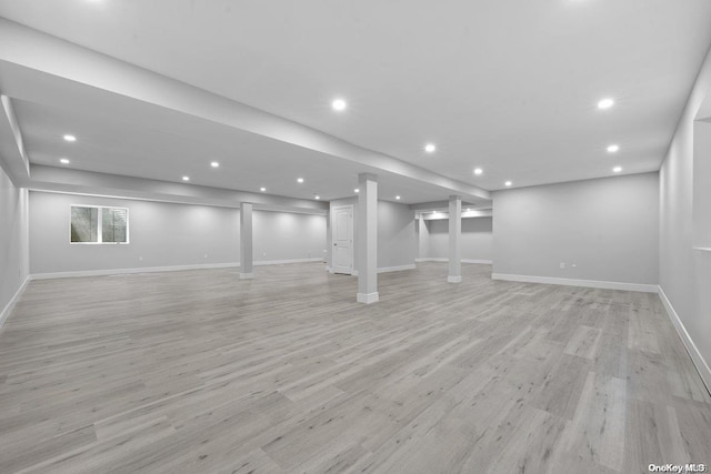 basement featuring light hardwood / wood-style floors