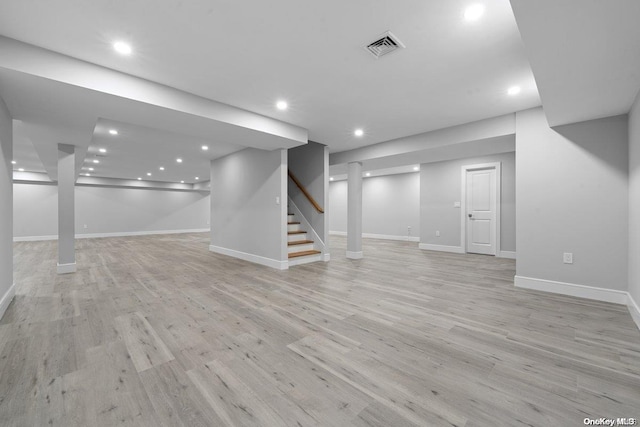 basement featuring light hardwood / wood-style flooring