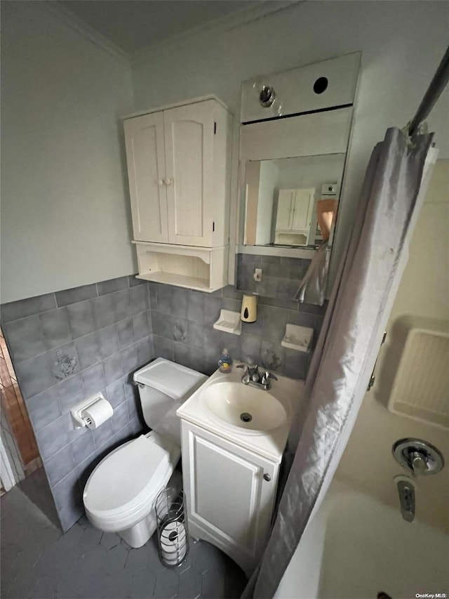 full bathroom with tasteful backsplash, vanity, washtub / shower combination, tile patterned flooring, and toilet