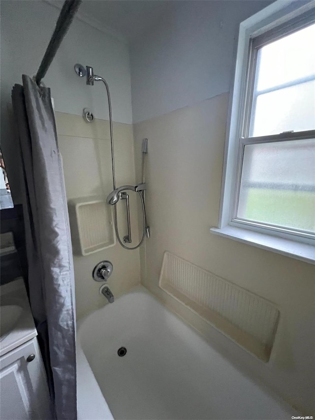 bathroom with shower / tub combo with curtain