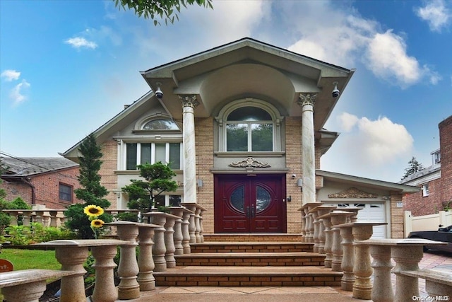 doorway to property with a garage