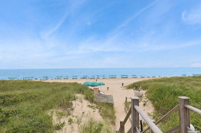 property view of water featuring a beach view