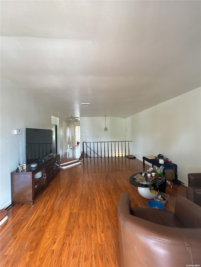 unfurnished living room featuring hardwood / wood-style floors