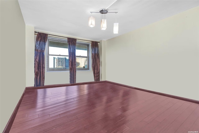 empty room featuring hardwood / wood-style flooring