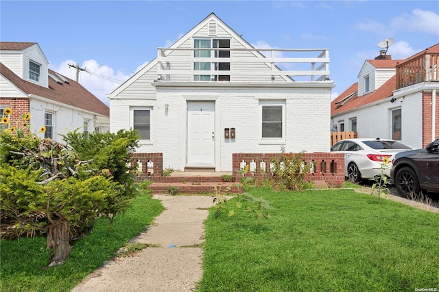 view of front of property with a front lawn