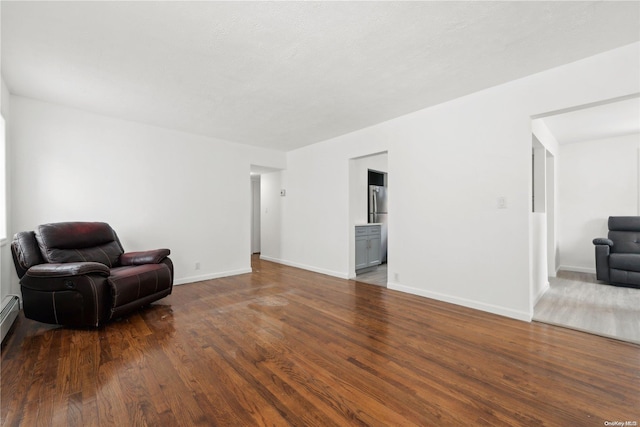 living area featuring dark wood-type flooring