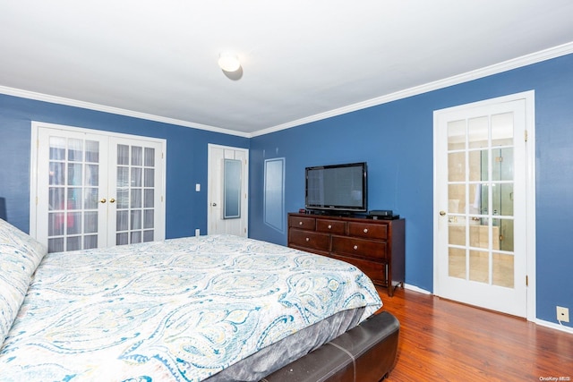 bedroom with french doors, dark wood-type flooring, and ornamental molding