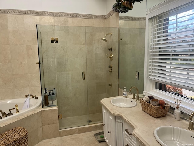 bathroom featuring vanity, tile patterned flooring, and plus walk in shower