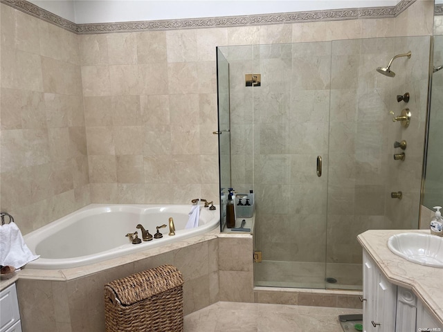 bathroom with separate shower and tub and vanity