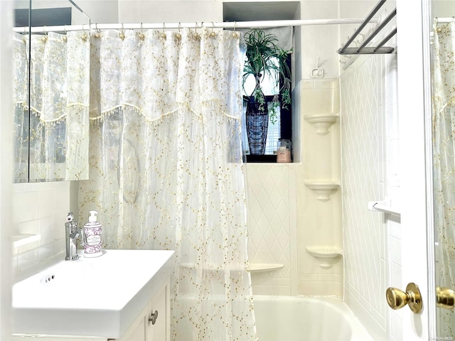 bathroom with vanity and shower / tub combo with curtain