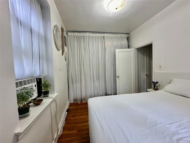 bedroom featuring dark hardwood / wood-style floors