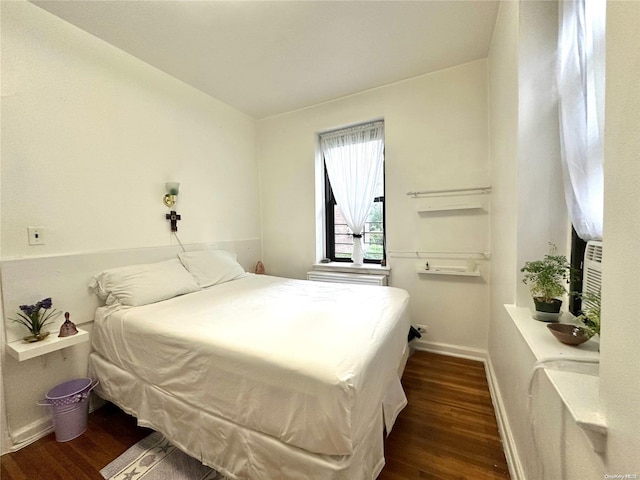 bedroom featuring dark hardwood / wood-style flooring