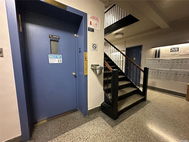 stairs with beam ceiling and mail boxes