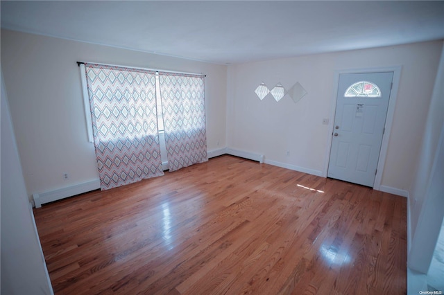 entrance foyer featuring light hardwood / wood-style floors and baseboard heating