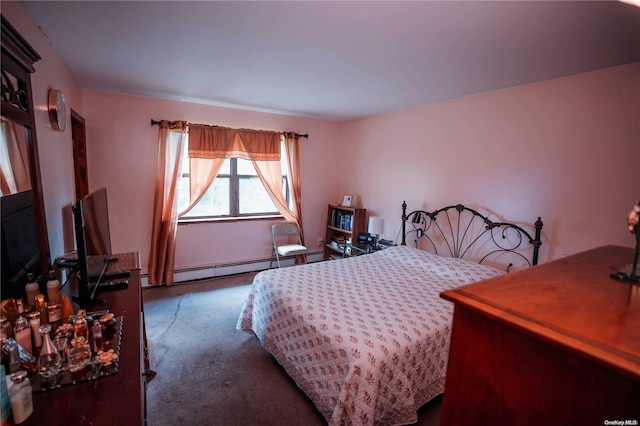 bedroom with dark carpet and a baseboard radiator