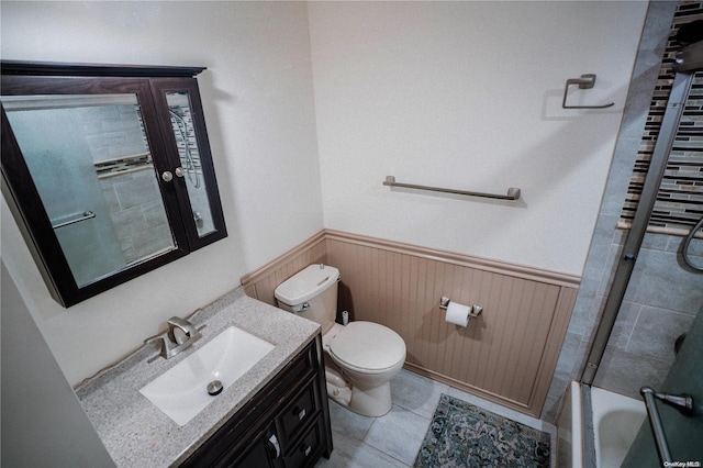 bathroom featuring tile patterned floors, vanity, and toilet