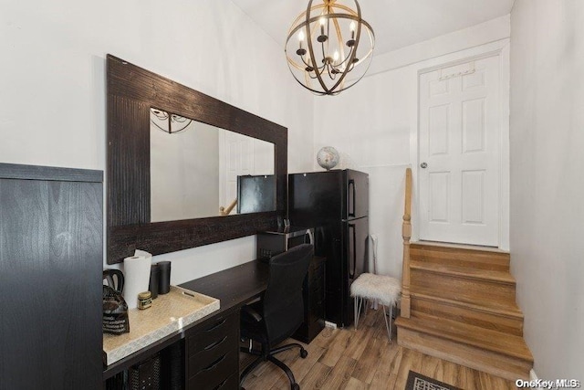 office space with hardwood / wood-style flooring and a notable chandelier