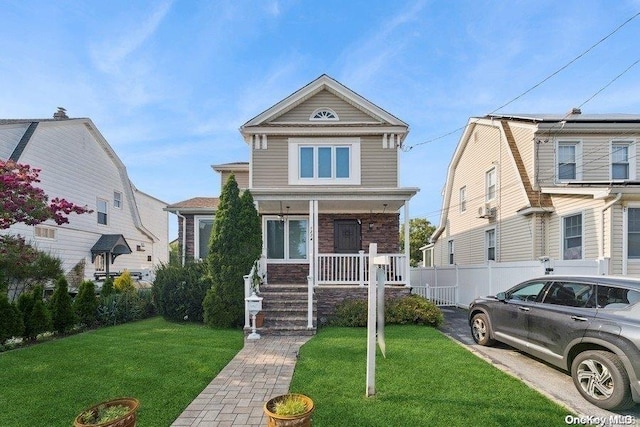 view of front of house featuring a porch and a front lawn