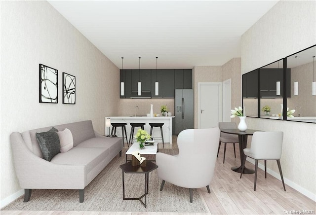 living room with light wood-type flooring and sink