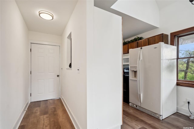 hall with wood-type flooring