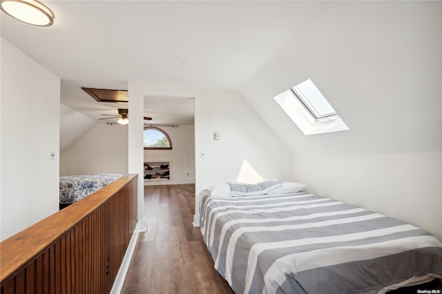 bedroom featuring dark hardwood / wood-style flooring and lofted ceiling