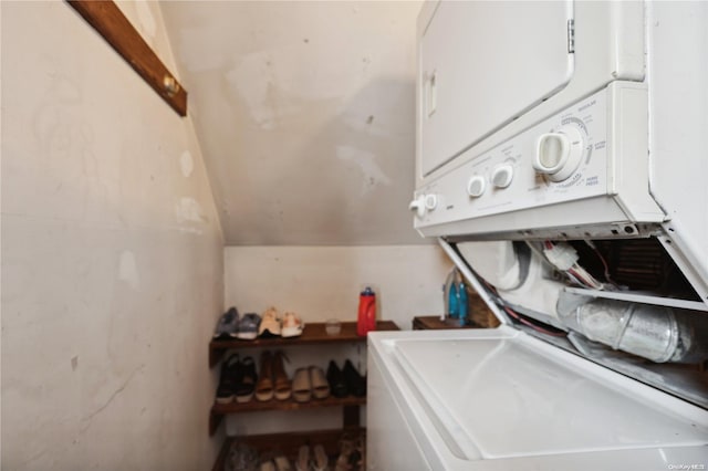 washroom featuring stacked washer / dryer