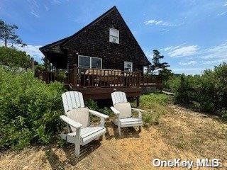 rear view of house with a deck