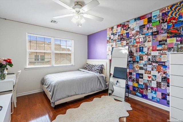 bedroom featuring ceiling fan and dark wood-type flooring