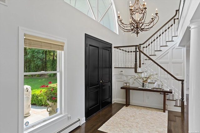 foyer featuring dark wood-type flooring and a baseboard radiator