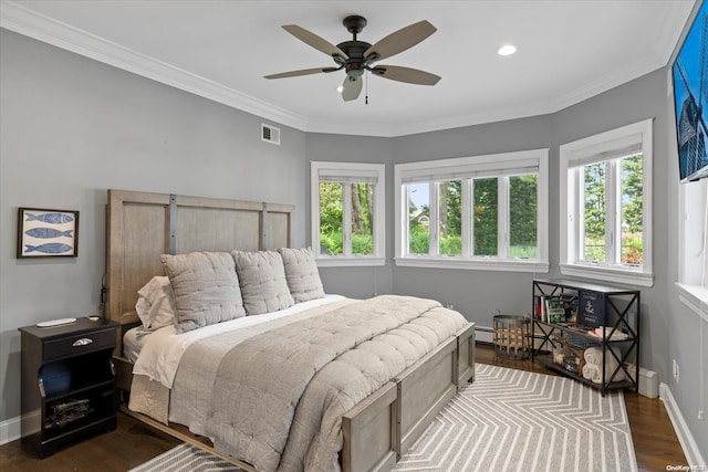 bedroom featuring multiple windows, dark hardwood / wood-style floors, ceiling fan, and ornamental molding