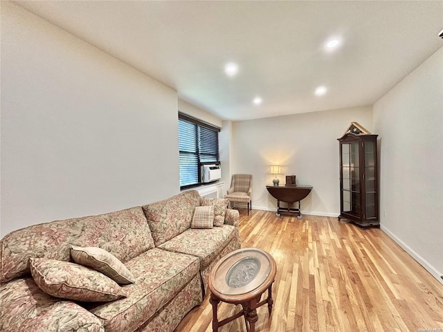 living room with light hardwood / wood-style flooring and cooling unit