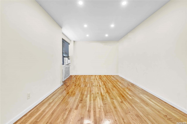 spare room with light hardwood / wood-style floors