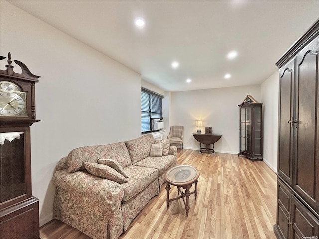 living room featuring light hardwood / wood-style flooring and cooling unit