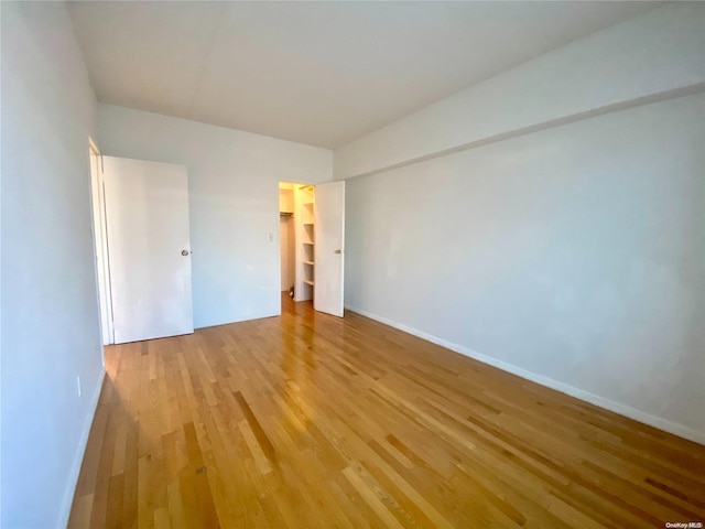 empty room with light hardwood / wood-style floors