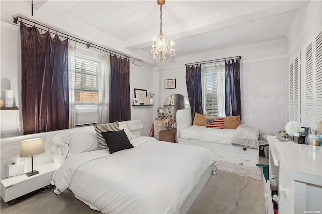 bedroom with light colored carpet, an inviting chandelier, and a closet