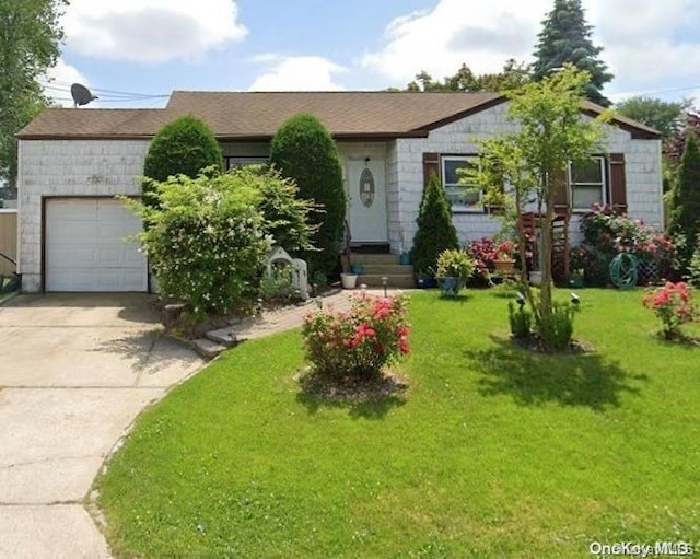 view of front of home with a garage, concrete driveway, and a front lawn